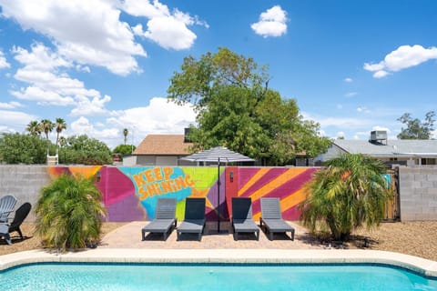 Enjoy poolside comfort under our stylish umbrella on lounge chairs