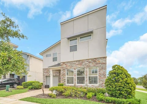 Step into luxury with this elegant stone-accented façade