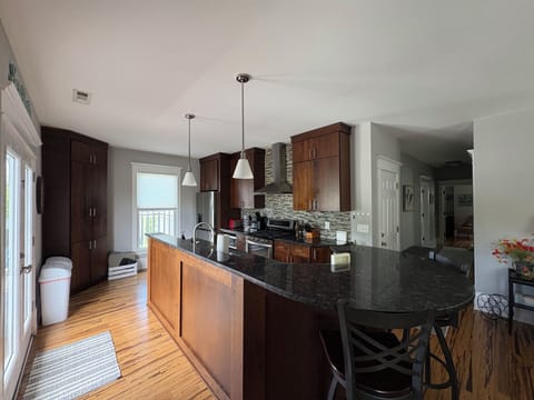 Kitchen with stove, oven, fridge, microwave & dishwasher. (fully stocked)