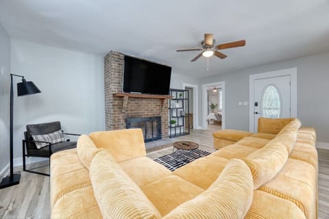 Large sectional for family gathering with 65 inch Smart TV