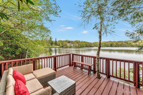 Deck with a View: Enjoy serene lake views from plush seating, perfect for sunset cocktails!