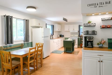 Large open kitchen and family size dining table