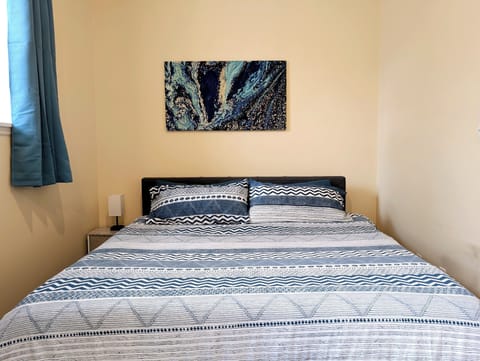 This king-sized bedroom offers the perfect retreat for relaxation and comfort.
