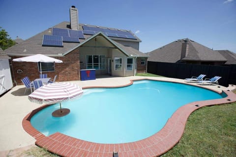 Create lifelong memories with a stunning outdoor space, combining an exhilarating pool and inviting dining area, tailored for family bonding and celebration.