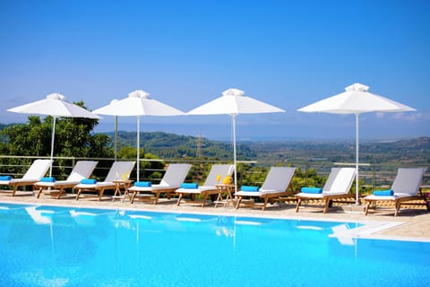 Seasonal outdoor pool, open 8:00 AM to 8:00 PM, pool umbrellas
