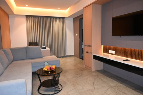 Luxury Suite, City View | Living area | 43-inch LED TV with cable channels