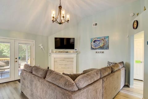 Inviting living room featuring a blend of modern design and beach-inspired decor, perfect for relaxation and entertaining.