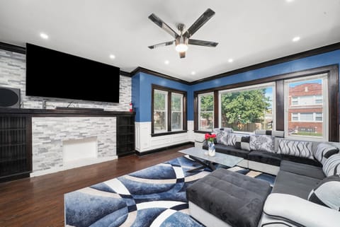 Living Room with 85 Inch Samsung 4K TV, Dolby Atmos Surround Sound, Sofa