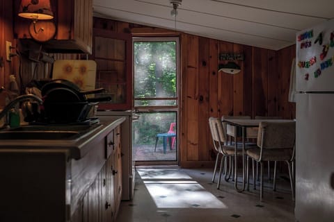 Kitchen with access to patio, including microwave, coffee maker, toaster
