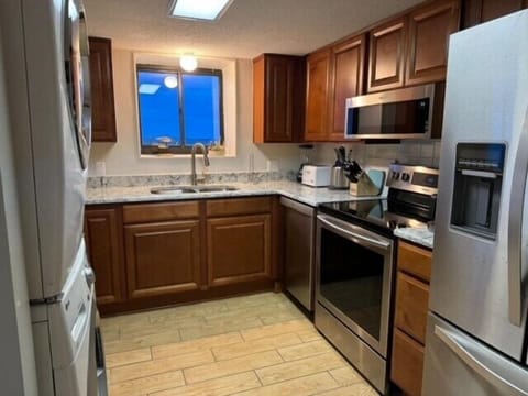 Updated kitchen with cookware, dishes, and utensils provided.