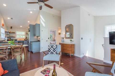 Airy loft living meets modern comfort—bright living area, vaulted ceilings, and open layout flowing into the chef's kitchen."
