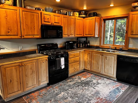 View of the Kitchen that has DW, Over, Fridge, Microwave and is fully Stocked!