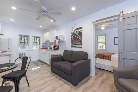 Unwind in the inviting living room, featuring comfortable seating and a warm ambiance, ideal for relaxation after a day of exploration.