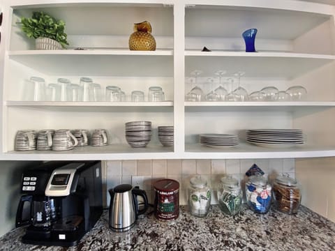 Fully stocked coffee and tea nook. Brew you own cup or pop in a Keurig. 