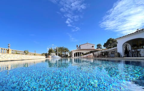 The private pool with terrace and sun loungers — where hours stretch out under the Javea sun.