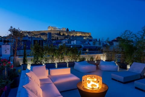 Where ancient light meets modern calm — the Acropolis framed by fire and stillness.