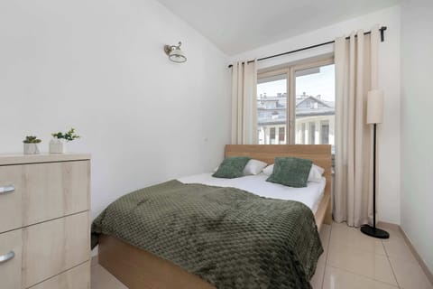 Beautiful bedroom with a double bed, soft lighting, and neutral decor.