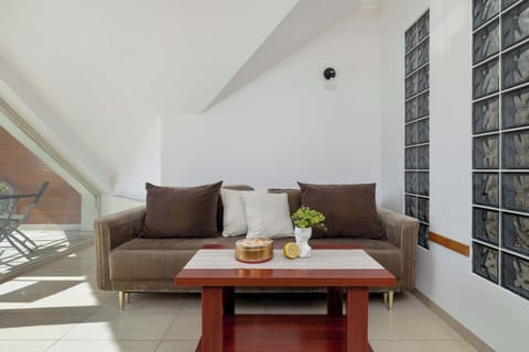 Cozy bedroom with a sofa bed and a coffee table.