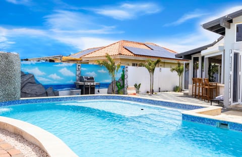 Relax by the pool with BBQ area