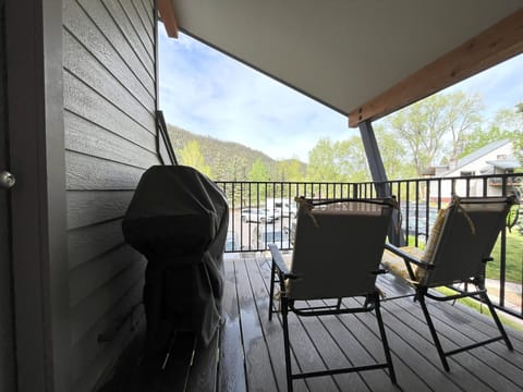 Deck off living room with mountain views