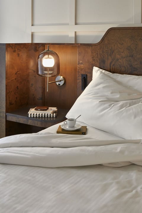 Premium bedding, desk, laptop workspace, free WiFi