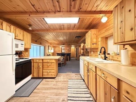 Kitchen includes appliances, cookware, dishes, silverware, and basic spices.