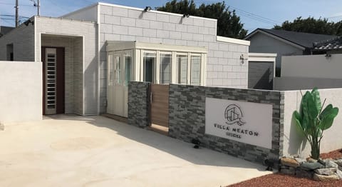 Exterior and parking space (white concrete area)