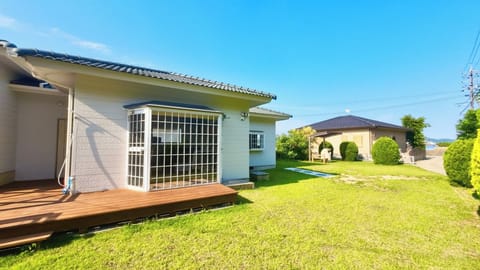 Garden: Wooden deck with shower, BBQ space, pizza oven
