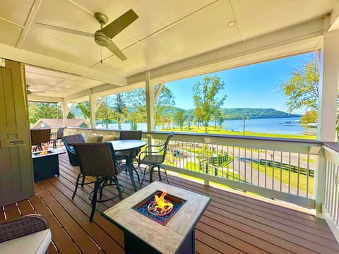 Balcony with 2 fire pits, dining area, & lounge furniture, & a beautiful view!