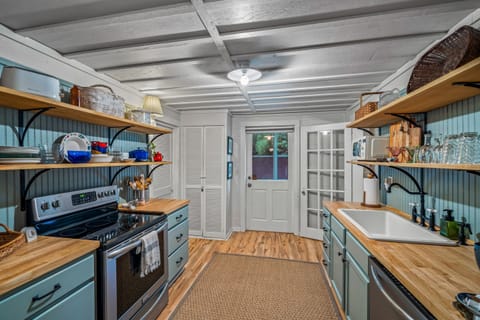 Open kitchen between bunk room and back sunroom porch