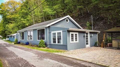 Sunset Retreat is a 2-bedroom, 2-bathroom lakefront getaway with a hot tub, lakeside firepit, outdoor dining area, and plenty of yard space to relax and enjoy the view.