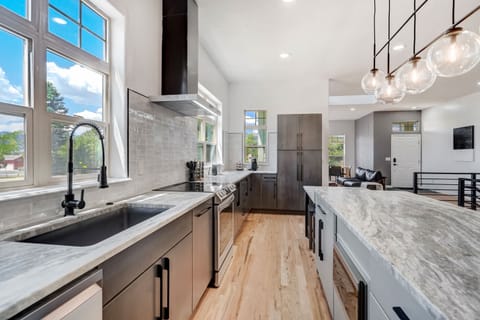 Stainless steel appliances and marble countertops for a contemporary feel.