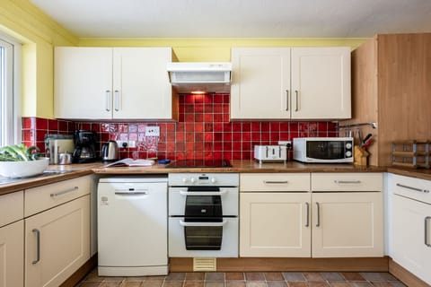 Stradav, Polzeath. Second Floor: With an electric oven and hob, fridge/freezer, microwave and dishwasher