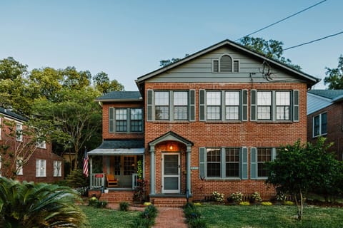 Brick pathwathway is lit up to your front door. 