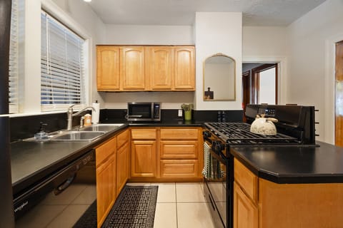 Downstairs fully-stocked kitchen.