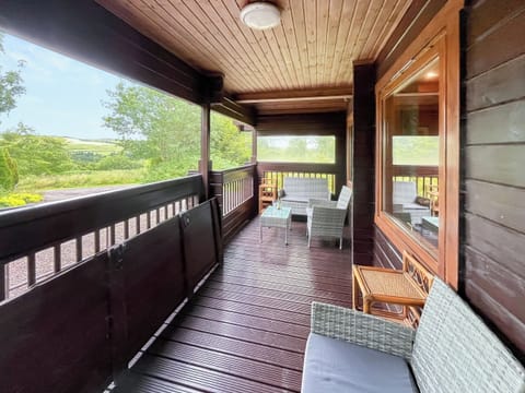 Lovely shady verandah over looking the garden | Criffel Lodge, Tongland, Kirkcudbright