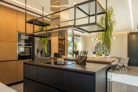The fully equipped kitchen, where modern appliances and sleek design make a self-catered holiday feel effortless.