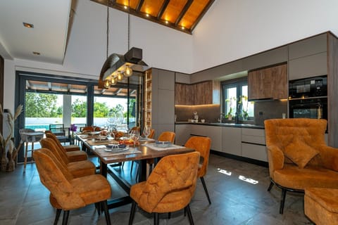 60 square meter open-plan living and dining area with a dining table for eight