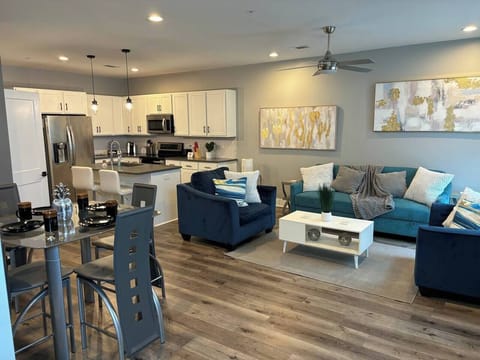 Living Room: Bright open space with stylish seating, modern kitchen, and vibrant decor. Enjoy!