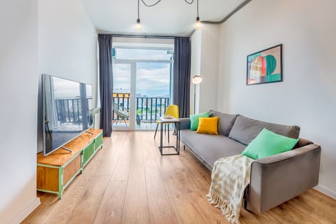 Apartment, Balcony, City View | Living area | 45-inch LED TV with digital channels