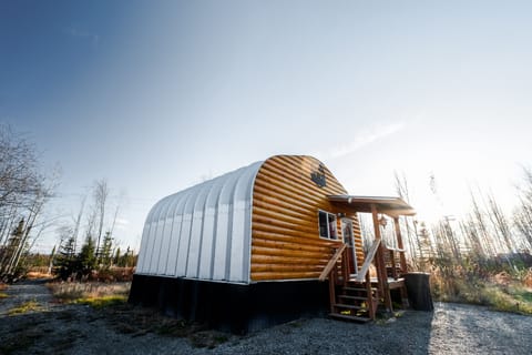 The building is a Quonset Hut. We'd refer to this cabin as "The Hut" early on