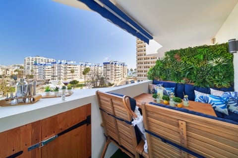 Terrace with outdoor dining area and sea view.