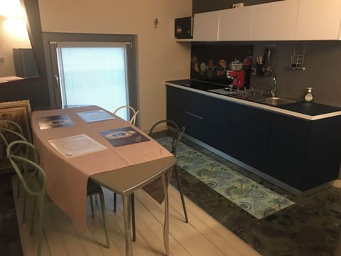 Deluxe Condo, 2 Bedrooms | Private kitchen | Microwave, stovetop, dishwasher, griddle