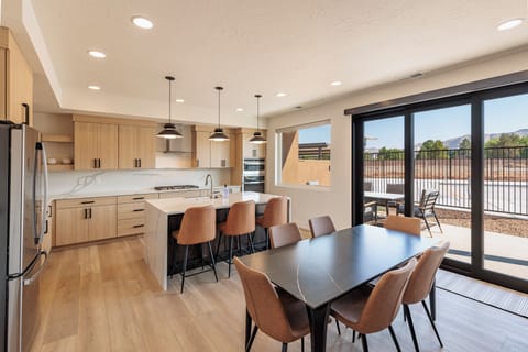 Kitchen Dining Table and Patio View - Enjoy the beautiful view outside while you prepare meals with your friends and family.