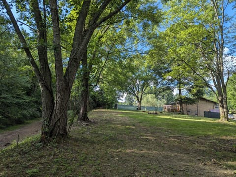 A view from the top of the lake trail facing the rear of the home
