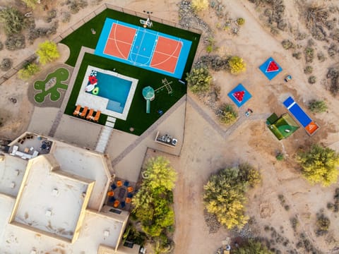 From the elevated rooftop lounge to the vibrant backyard packed with games, a pool, and a sport court—this property is built for unforgettable fun under the desert sun. | The Sonoran, Scottsdale, Arizona | Voyax Luxury Vacation Rentals