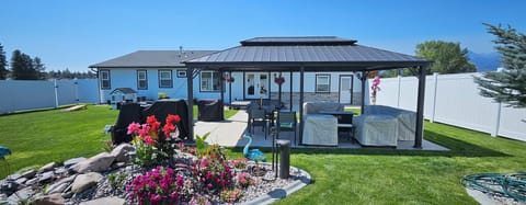 Backyard oasis with pondless waterfall 20x28 patio, gazebo, bluetooth speakers.