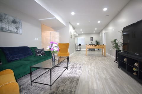 Spacious living room with comfortable furniture and a smart TV