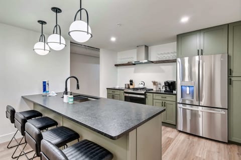 Modern style meets function with sleek finishes and ample seating for culinary adventures!