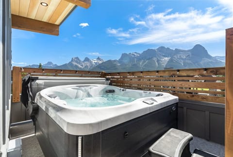 Relax and unwind in the private hot tub with breathtaking views of the majestic Canadian Rockies.